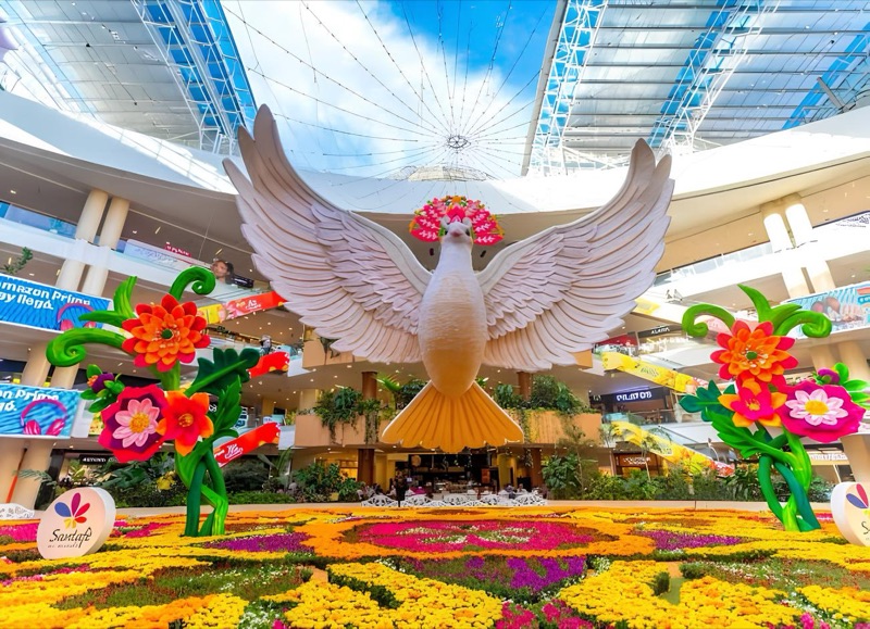 A giant white dove sculpture and a carpet of living flowers in Santafé's central plaza during the Feria de las Flores